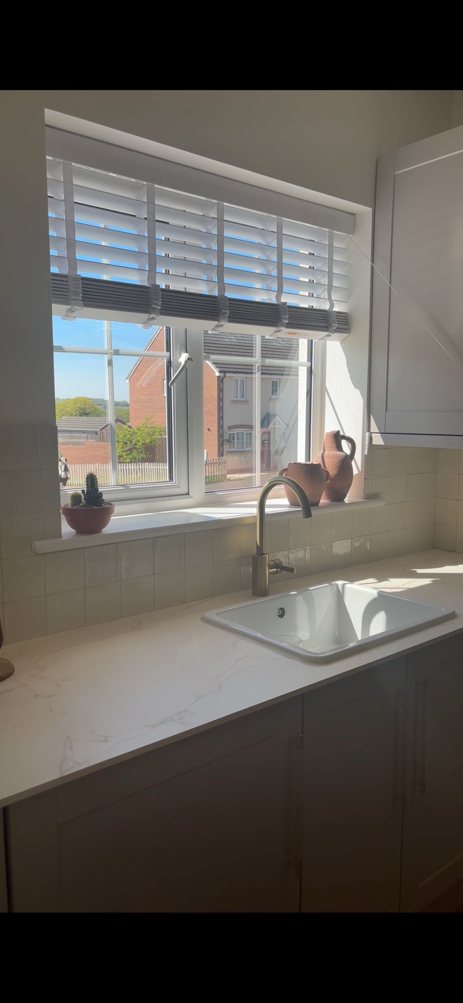 Kitchen renovation with marble worktops and tiled splashback, Cardiff